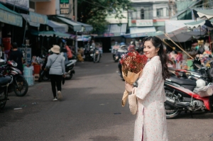A Woman's Day Out: A Journey Amidst Beautiful Flowers at a Bustling Market