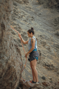 Adventurous Girl Conquering Rocky Heights: A Journey in Rock Climbing