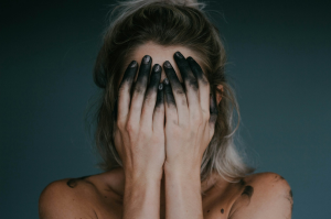 Artistic Expression: A Girl Model with Painted Hands