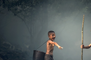 Asian Boys Engaged in Serene Fishing Activity: Nature's Prey