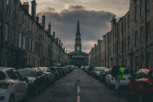 Calm Daytime Scene in a UK Street Packed with Parked Cars