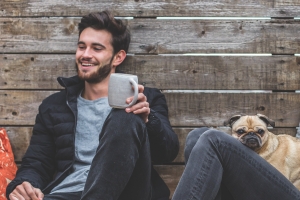 Cozy Moments: A Couple's Relaxed Time with Their Pet in Rustic Apparel