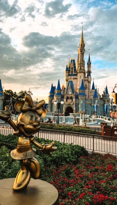 Enchanting Disney Castle and Character Statue