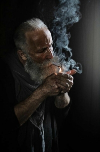 Intriguing Portrait of an Elderly Gentleman Amidst Smoke