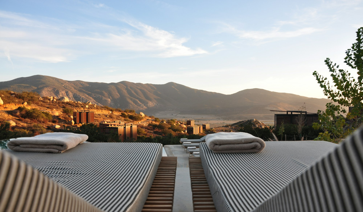 Sunset Serenity: Lounge Chairs Overlooking Mountainous Majesty