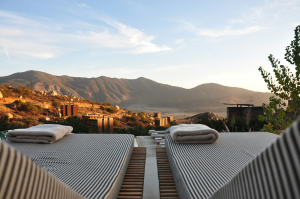 Sunset Serenity: Lounge Chairs Overlooking Mountainous Majesty