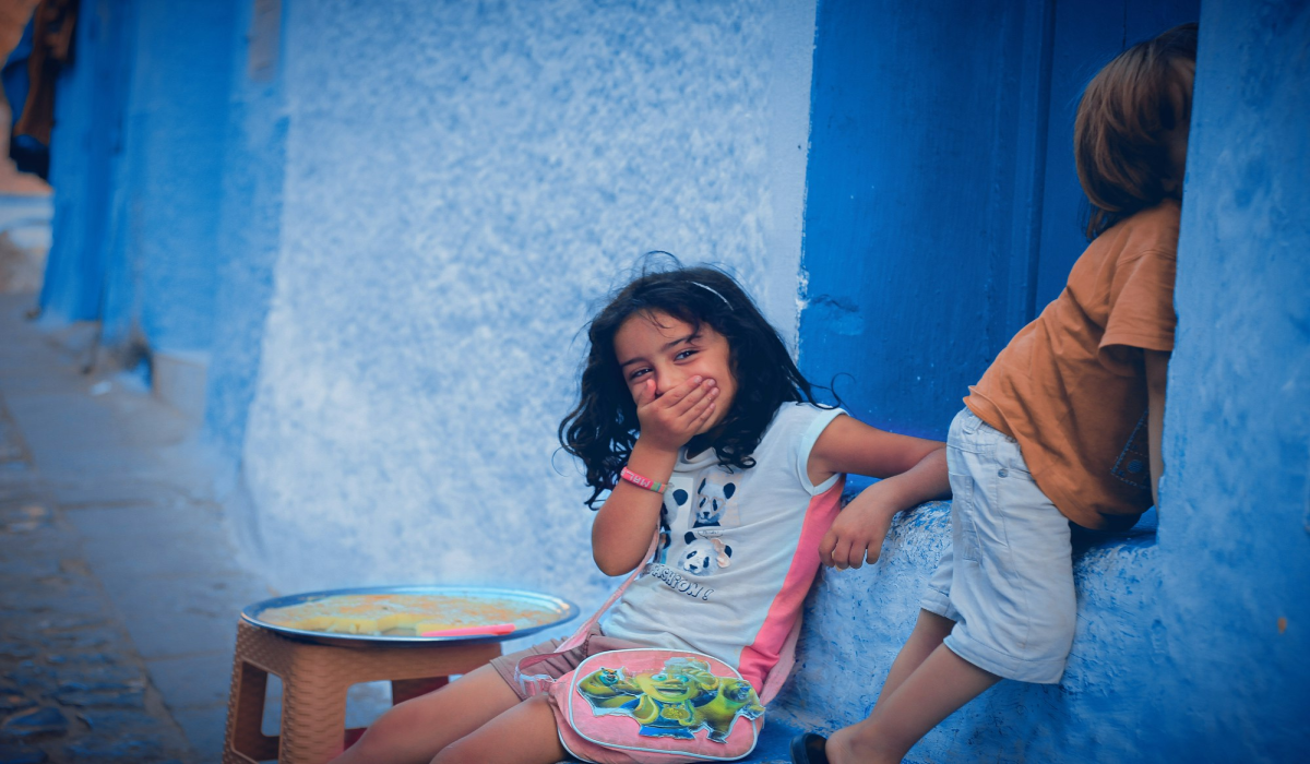 The Joyful Moment: A Little Girl's Smile in a Colorful Playroom