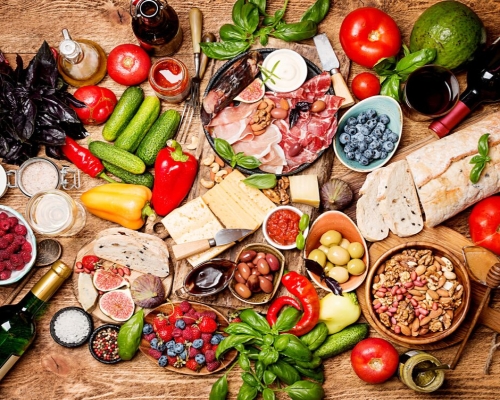 Vibrant Spread of Fresh Foods: Vegetables, Meats, Cheeses, and More
